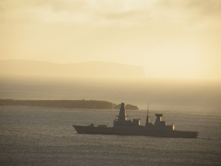 HMS Dauntless passing Swona