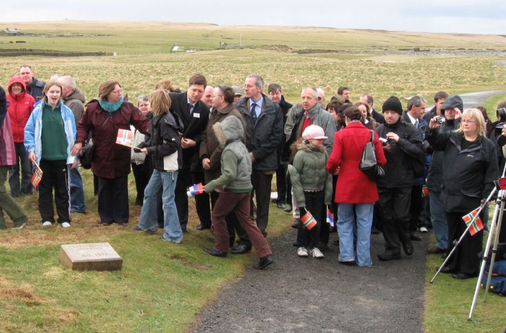 Throng at unveiling of new timeline stone