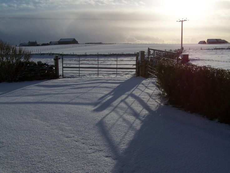 Shadows over a snowy Harray