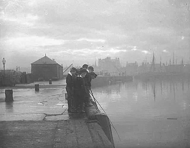 Fishing off the harbour - c1910
