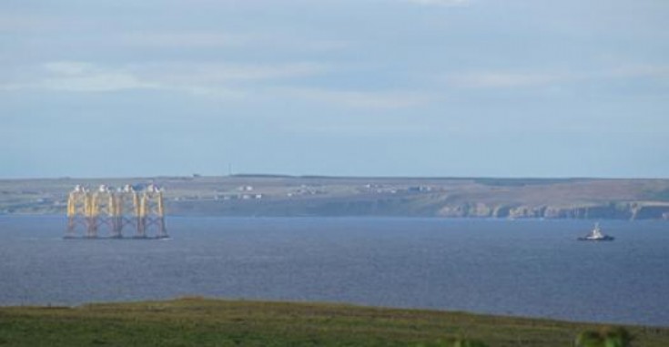 Tug and barge passing through Firth