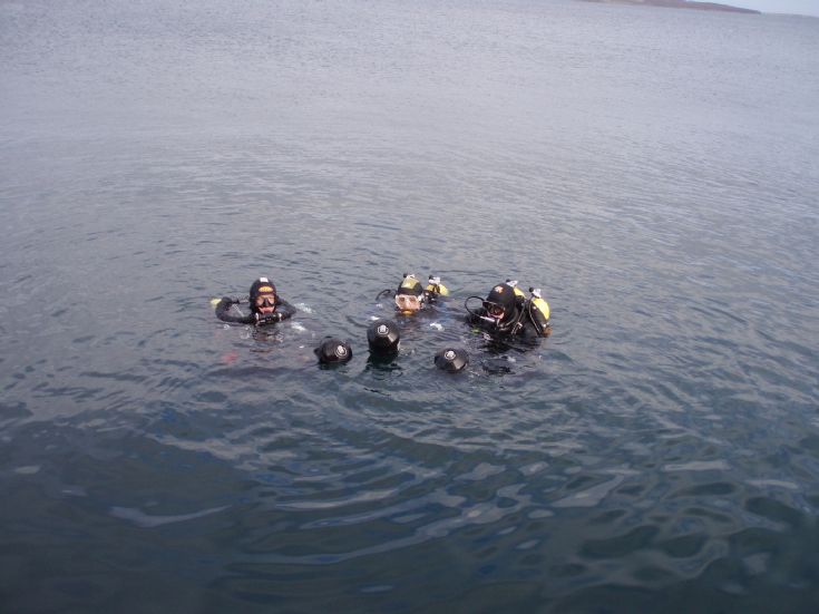 Divers with Scooters in the Flow