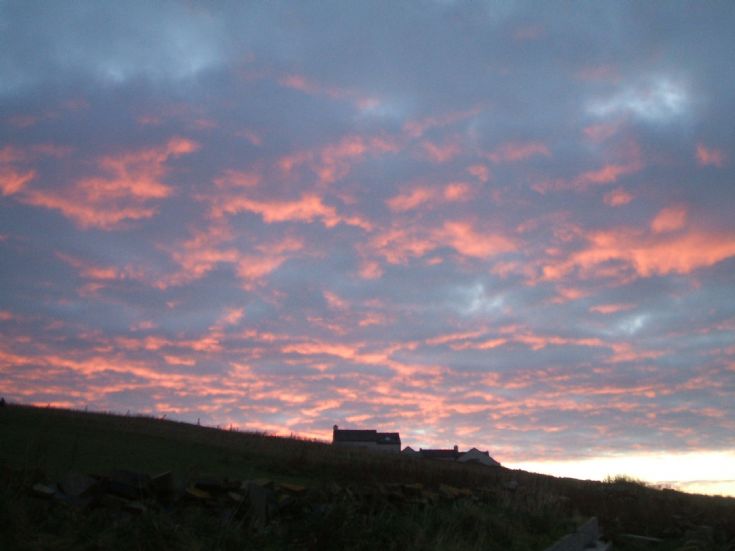 Sunrise over hill in Marwick